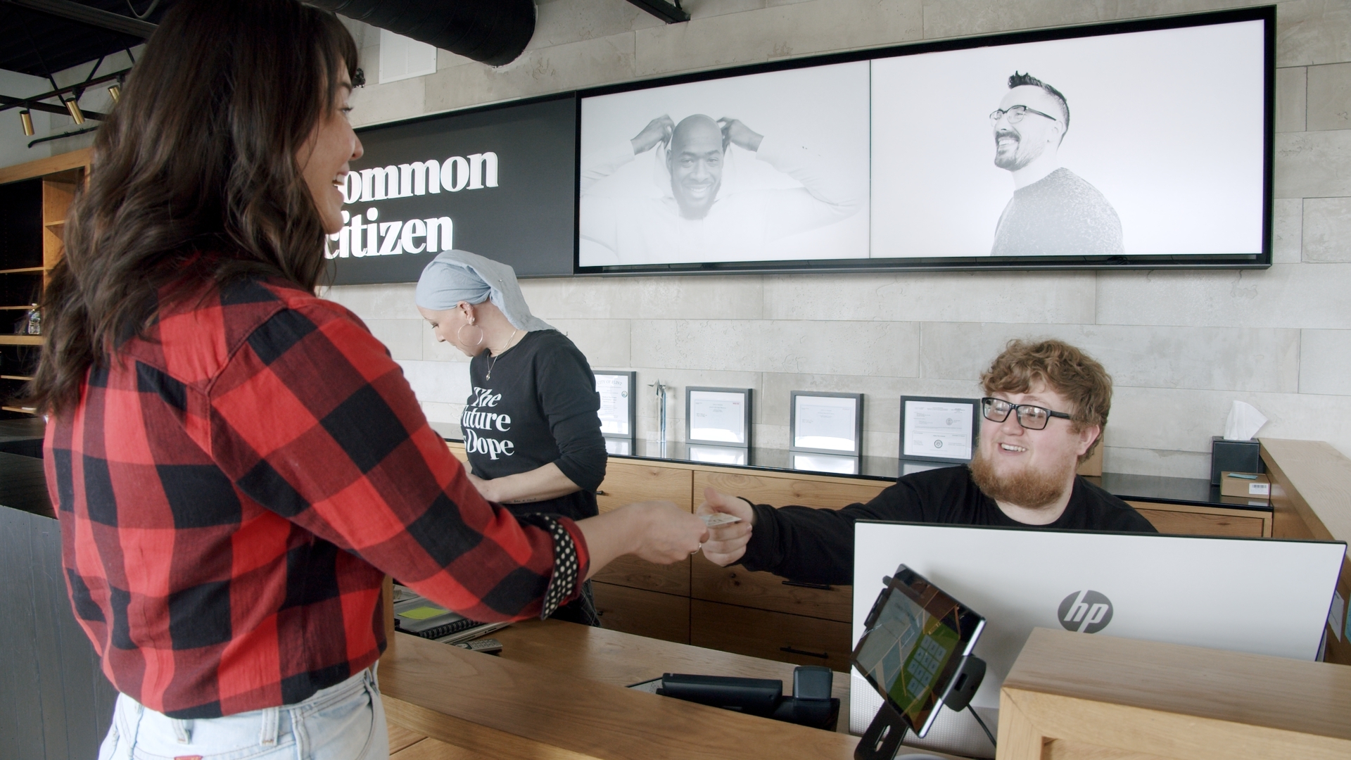 A customer checks in at cannabis dispensary Common Citizen